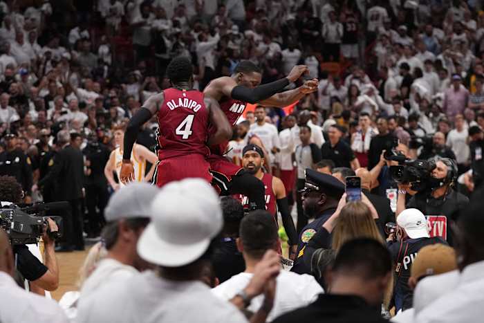 Apr 26, 2022; Miami, Florida, USA; Miami Heat center Bam Adebayo (13) and Miami Heat guard Victor Oladipo (4) celebrate after defeating the Atlanta Hawks in game five of the first round for the 2022 NBA playoffs at FTX Arena.